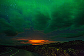 aurora borealis and the glow from the eruption of the volcano holuhraun spewing out lava and toxic gasses (sulphur dioxide) over northern europe, bardarbunga volcanic system, northeast iceland, region of myvatn lake, iceland, europe