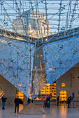 the carrousel du louvre and its inverted pyramid, situated below the tuileries gardens, is both a shopping mall and cultural and historical space, (75) paris, ile-de-france, france