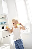 Little boy brushing his teeth