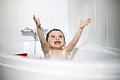 Little boy taking a bath
