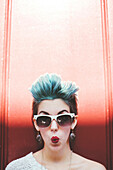 Stylish Caucasian woman with sunglasses and dyed hair