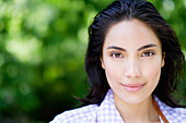 Close up of Hispanic woman smiling outdoors