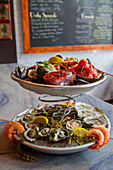 Platters of Raw Oysters on Half-Shell, Mussels, Lobster and Shrimp at Restaurant