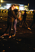young couple kissing at the music festival, Rock am Ring, Nuerburgring, Nuerburg, Germany