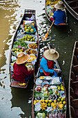 High angle view of merchants selling fruit in canoes