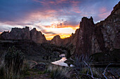 Creek reflecting sunset sky in desert landscape, Smith Rock State Park, Oregon, United States