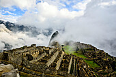 Aerial view of Macchu Picchu ruins in remote landscape, Cusco, Peru