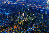 Aerial view of Manhattan cityscape and river at night, New York, United States