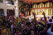 People cheering at Holi Festival, Vrindavan, Uttar Pradesh, India