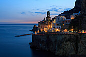 Amalfi coast road light trails from cars with Church of Santa Maria Maddalena at blue hour, dusk, Atrani, Costiera Amalfitana (Amalfi Coast), UNESCO World Heritage Site, Campania, Italy, Europe
