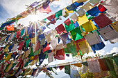 The Tibetan prayer flags made of colored cloth that are often hung on the top of the mountains to bless places, Bhutan, Asia