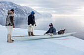 Inuit hunters use a kayak with a sealskin float to retrieve seals hunted at the floe edge, Greenland, Denmark, Polar Regions