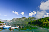 boats and reflection at Lake Bohinj, with mountains and wood in the background, Ribcev village, Stara Fuzina, Bohinj, Gorenjska, Julian Alps, Triglav National Park, Slovenia, Europe