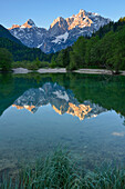 reflection of mountains among them Razor and Prisojnik in alpine lake Jasna, Kranjska Gora, Gorenjska, Triglav National Park, Julian Alps, Slovenia, Europe