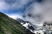 Clouds breaking around Byron Glacier in Portage Valley, Chugach National Forest, Alaska, United States of America