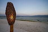 Lamp on the beach at dusk, Gili Trawangan, West Nusa Tenggara, Indonesia