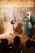 Tuareg teacher and girl in front of a blackboard at a primary school in Tiriken, Mali