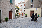 Nuns Walking Through The Streets Of Kotor, Montenegro