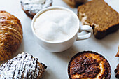 Close up of variety of pastries and coffee