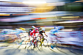 Blurred view of cyclists competing in race