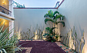 Landscaping along gravel path at hotel