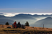 Couple on a bench at Belchen, Black Forest, Baden-Wuerttemberg, Germany