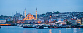 New Mosque Yeni Cami on the banks of the Golden Horn at night with Hagia Sophia Aya Sofya behind, Istanbul, Turkey, Europe