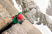 A woman rock climbing on the Diamond, Rocky Mountain National Park, Estes Park, Colorado.