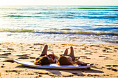 Surfer girls at the beach.