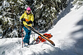 A woman backcountry skiing in Deer Creek, San Juan National Forest, Durango, Colorado.