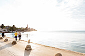 people walking at the waterfront of Porec, Istria, Croatia