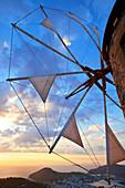 Windmills of Chora overlooking Skala at sunset, Patmos, Dodecanese, Greek Islands, Greece, Europe