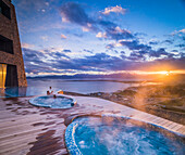 Outdoor swimming pool and hot tub at sunset, Hotel Arakur Ushuaia Resort and Spa, Ushuaia, Tierra del Fuego, Patagonia, Argentina, South America
