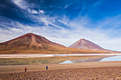 Tourists at Licancabur volcano on right and Laguna Verde, Bolivia near the border with Chile, Bolivia, South America
