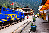 Train at Aguas Calientes, the stop for Machu Picchu, about to leave for Ollantaytambo, Cusco Region, Peru, South America