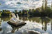 Statues and reflections at Schwetzingen Palace lake, Schwetzingen, Baden-Wurttemberg, Germany, Europe.