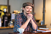 Caucasian man smiling in cafe