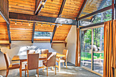 Dining table and windows in rustic dining room