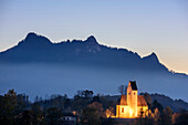 Illuminated church in front of Heuberg, Samerberg, Chiemgau, Chiemgau Alps, Upper Bavaria, Bavaria, Germany