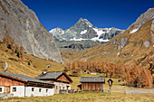 Alpine huts with Grossglockner in background, Lucknerhaus, Glockner Range, High Tauern, High Tauern National Park, East Tyrol, Tyrol, Austria