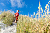 Boy in the dunes at Dueodde, sandy beach, Summer, Baltic sea, Bornholm, Dueodde, Denmark, Europe