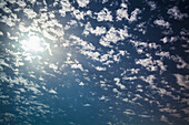 Cloud scattered in a blue sky with sunlight, Israel