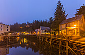 Tourist shops and homes along Creek Street in downtown Ketchikan on a foggy evening, Southeast Alaska, USA, Spring, HDR