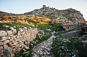 Ruins of stone wall and buildings, Corinth, Greece