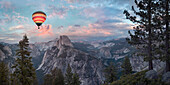 Hot air balloon flying over Yosemite, California, United States