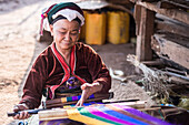 Palaung woman weaving, part of the Palau Hill Tribe near Hsipaw Township, Shan State, Myanmar Burma, Asia