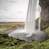 Behind Seljalandsfoss, a famous waterfall just off route 1 in South Iceland Sudurland, Iceland, Polar Regions