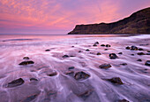 Colourful pink sunrise above Talisker Bay, Isle of Skye, Inner Hebrides, Scotland, United Kingdom, Europe