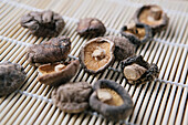Close-up of dried  mushrooms on bamboo mat