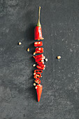 Directly above shot of chopped red chili pepper on table